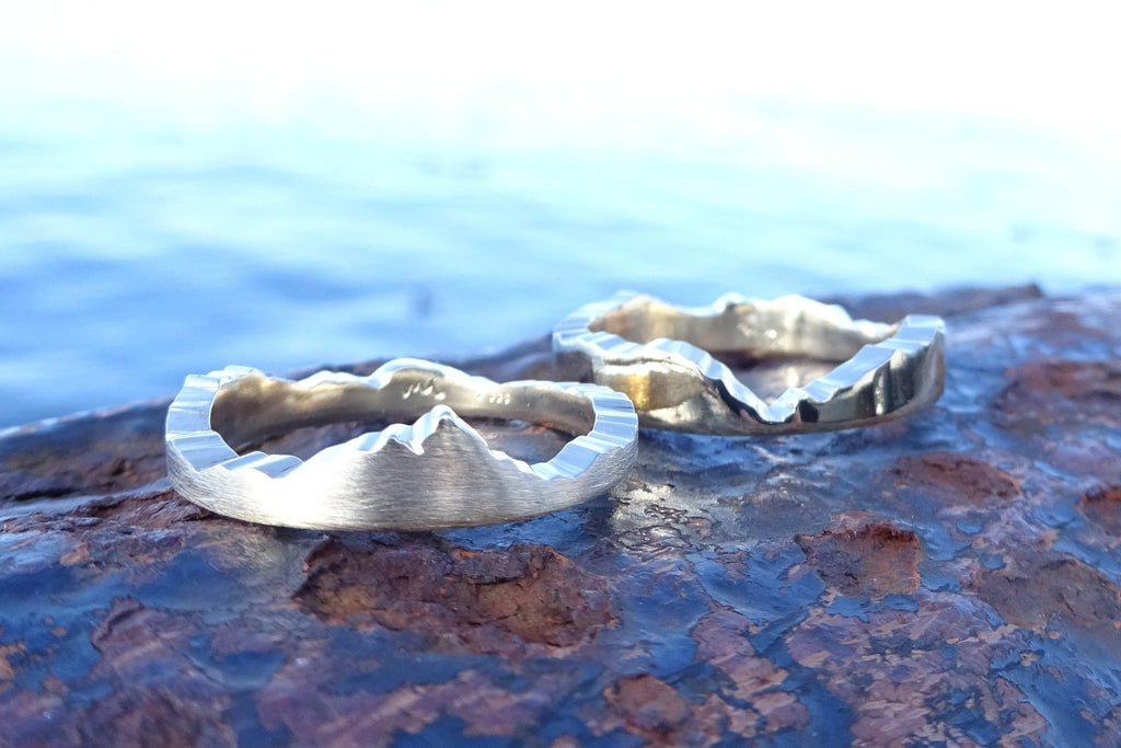 Custom Interlocking Mountain Ring handcrafted with your choice of recycle material and mountain range.  Each bespoke ring is handmade in Seattle WA by Michelle Lenae Jewelry 
