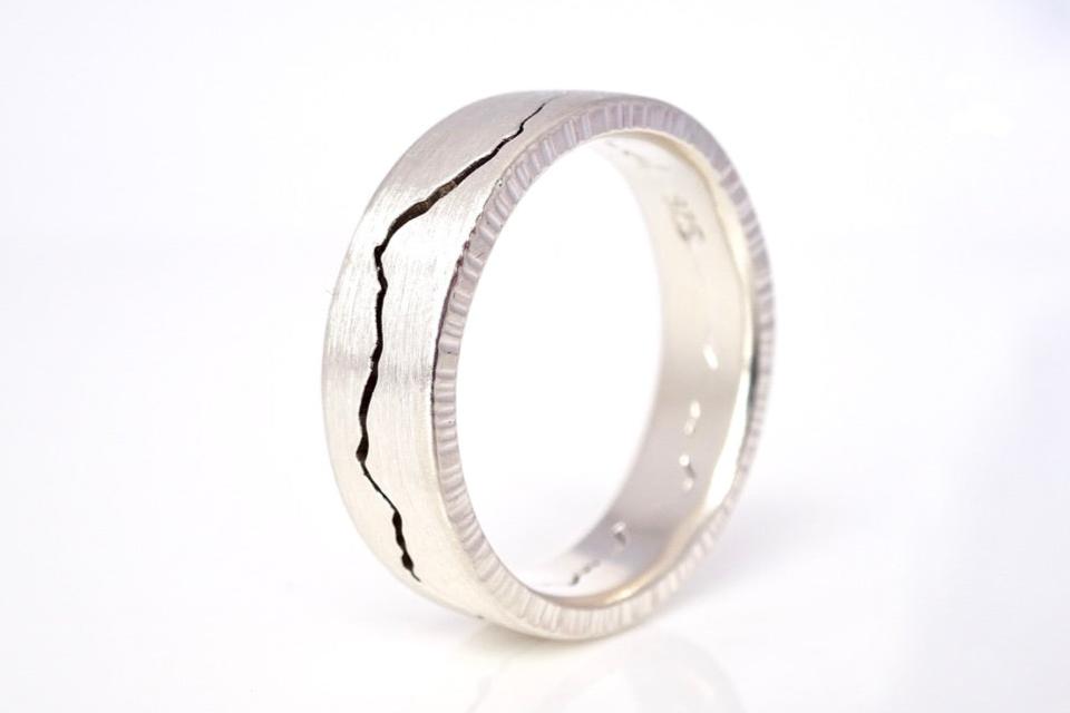 Each custom modern mountain ring features signature details and hammered edges with a true comfort fit