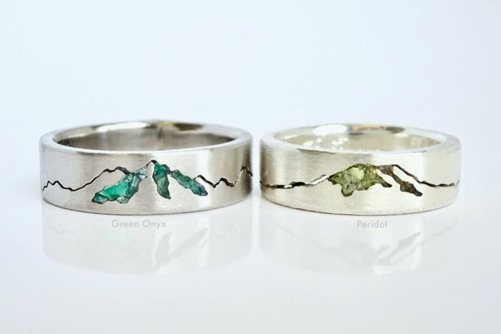 Close-up of custom Summit Rings featuring green onyx and peridot - all custom mountain rings made to order and personalized exclusively for you.