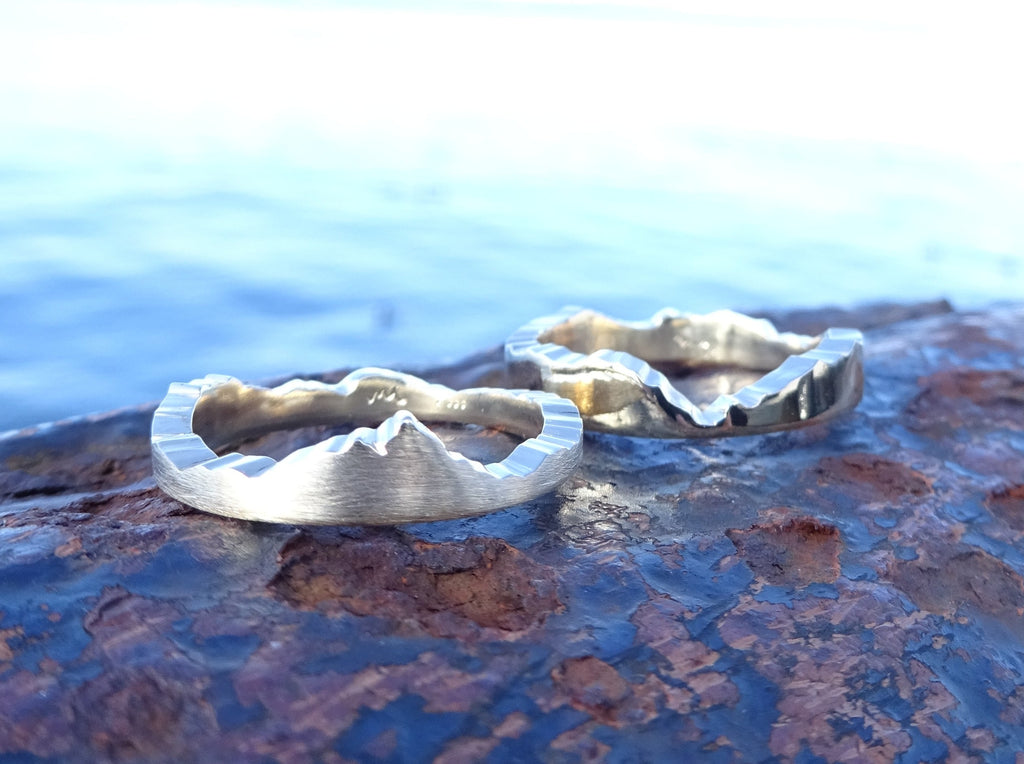 Split Puzzle Mountain Ring handcrafted with your choice of recycle material and mountain range.  Each bespoke ring is handmade in Seattle WA.  