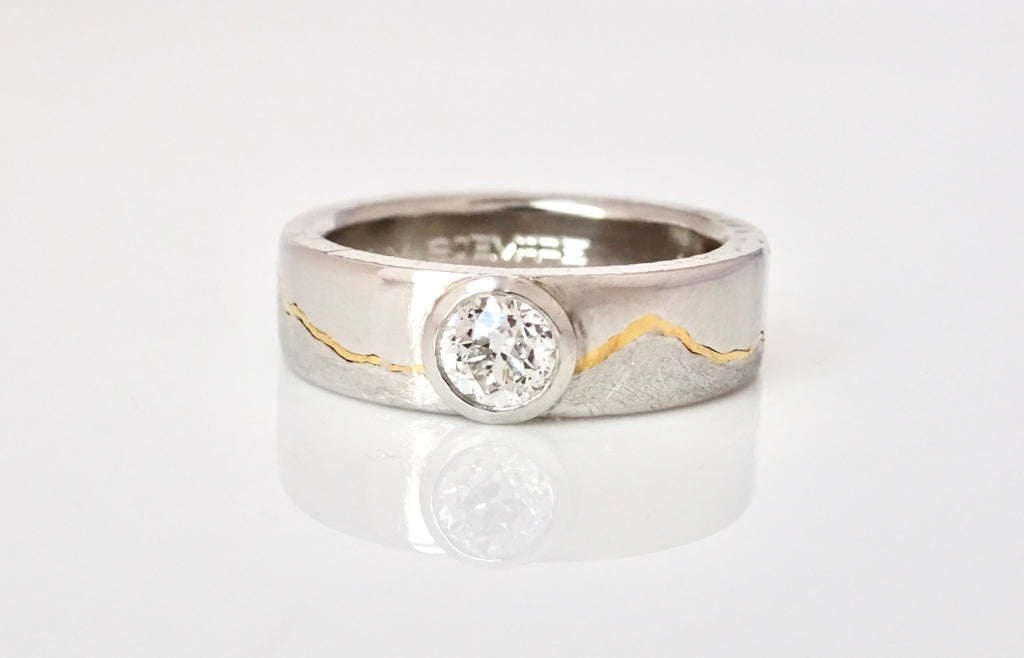 Diamond solitaire gold inlay mountain wedding band handmade to order by Michelle Lenae Jewelry.  Personalized with the mountain range of your choice.
