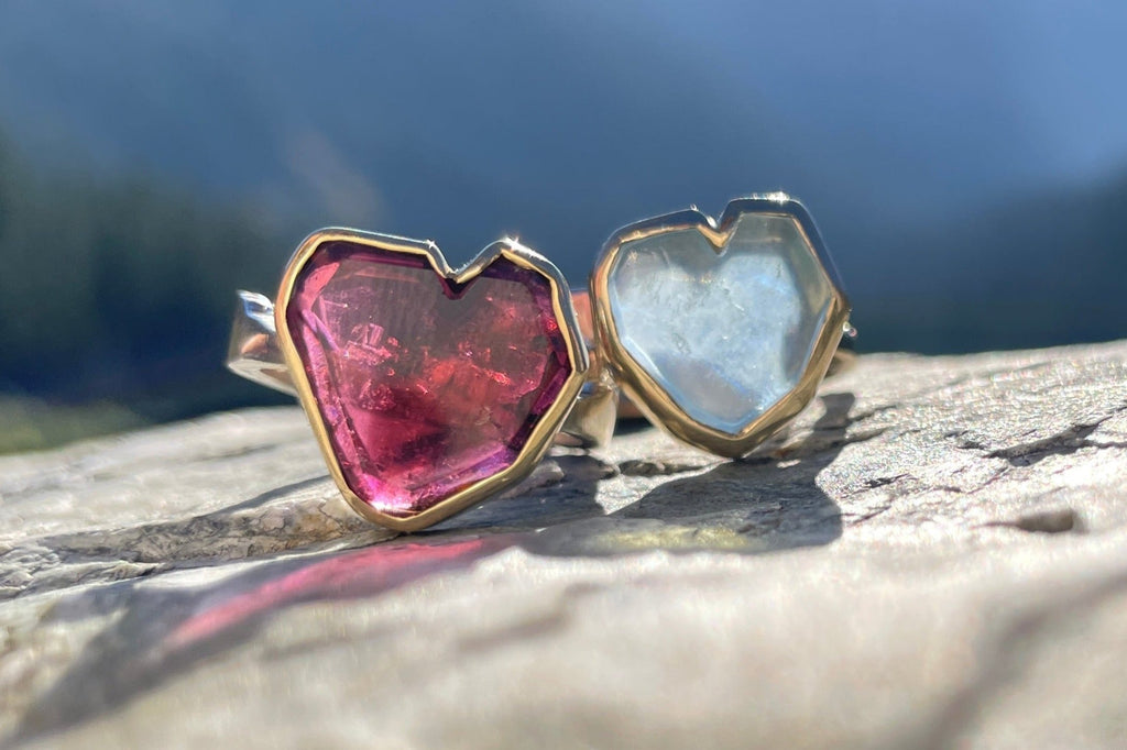 Handcrafted garnet & aquamarine heart rings in 14k gold