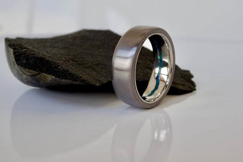 Mixed opal inlay with inner platinum band and tantalum outter