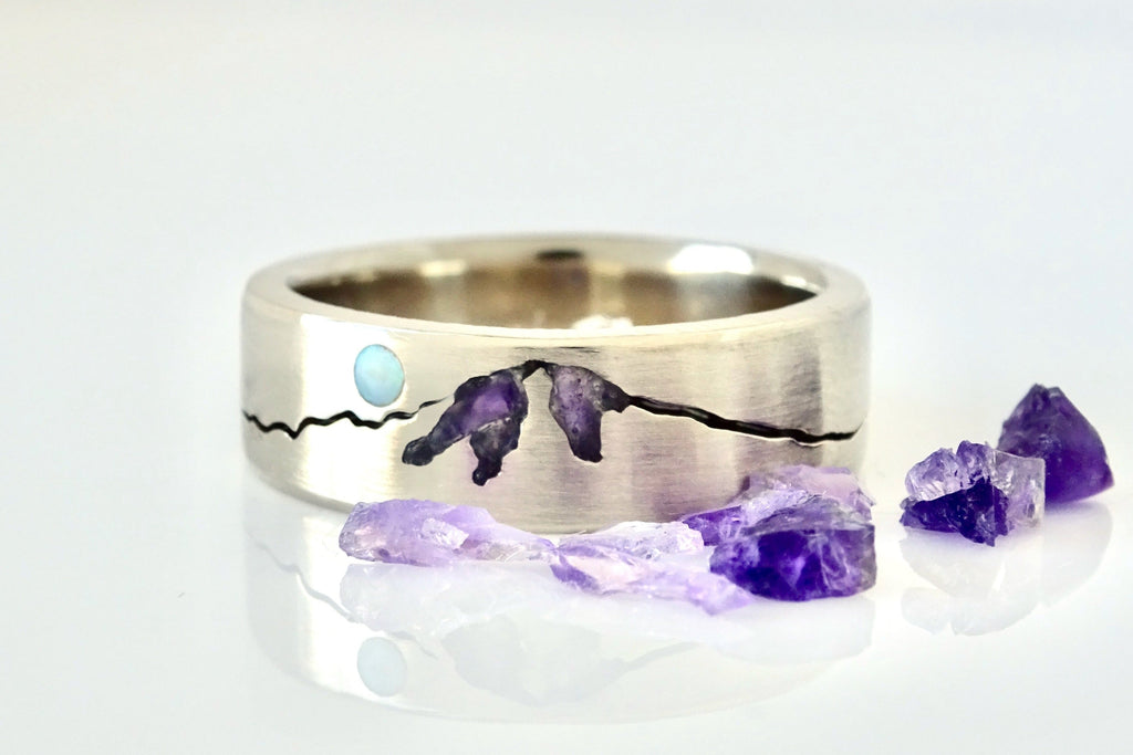 Close up look at a custom Mt Hood Summit ring with chipped amethyst & aquamarine moon