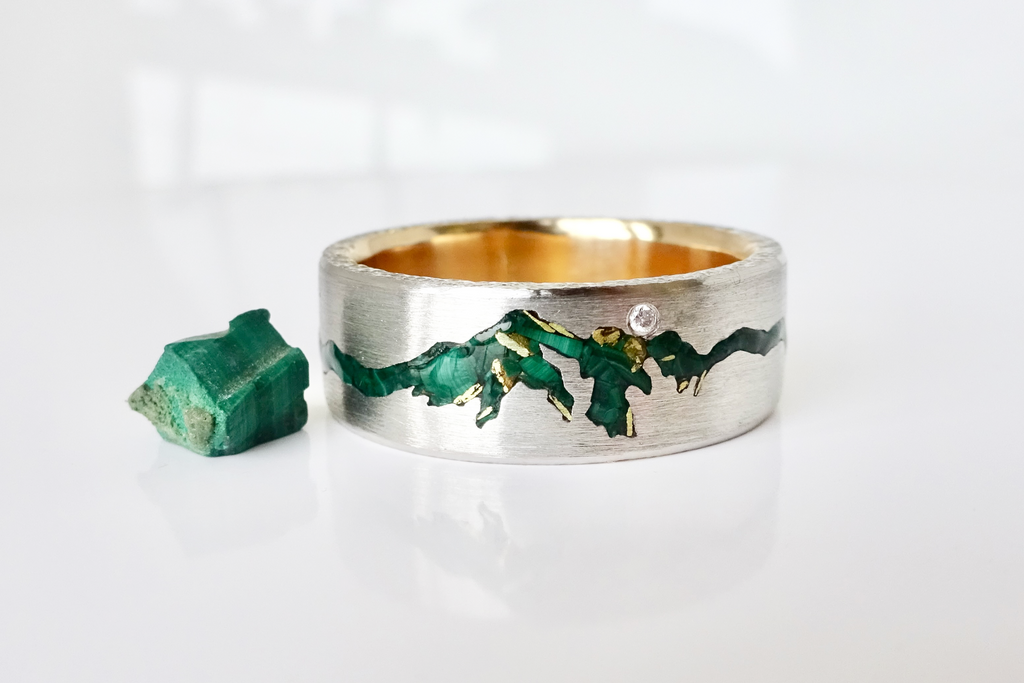 Summit & Range Inlay Mountain Ring featuring Alpental in Snoqualmie Pass WA.  Handcrafted with yellow gold sleeve and platinum inlayed with malachite and gold flakes