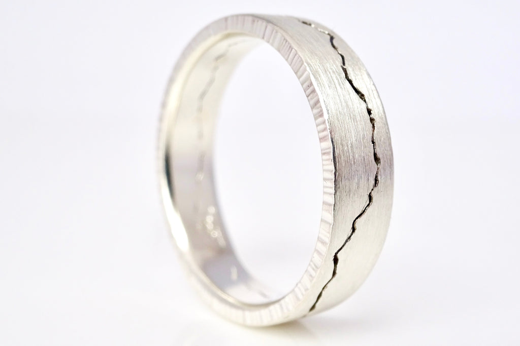 Custom Mountain Wedding Bands with brush finish and oxidized mountain silhouette