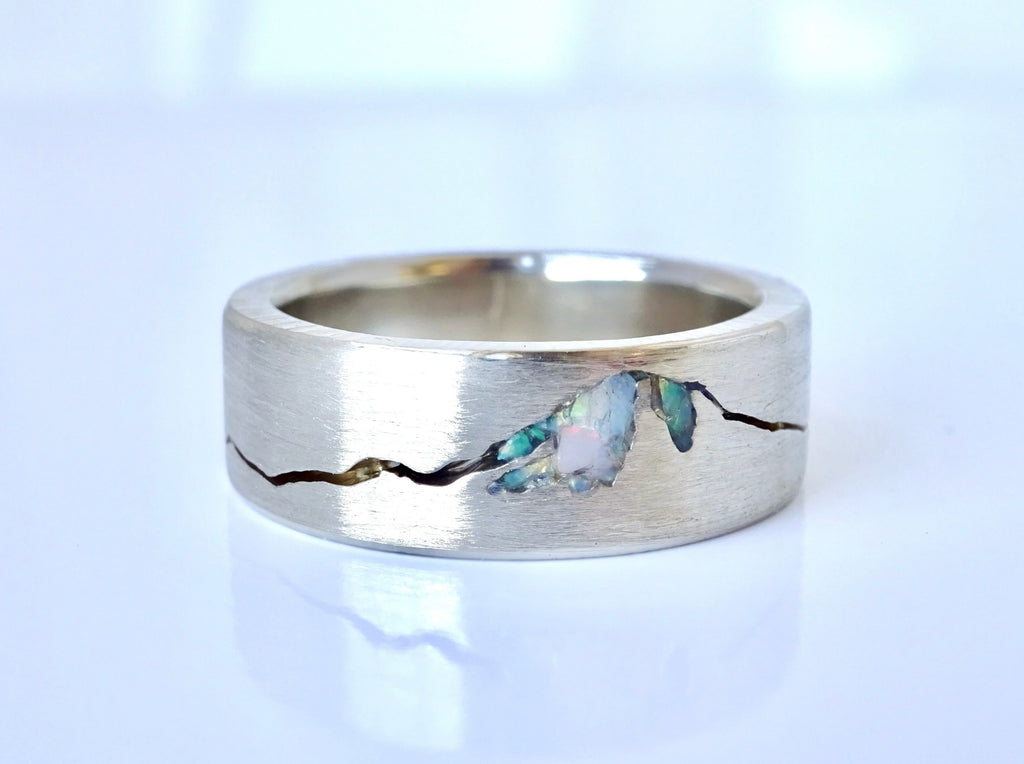 Platinum mountain wedding ring with Mt Hood design and opal inlay