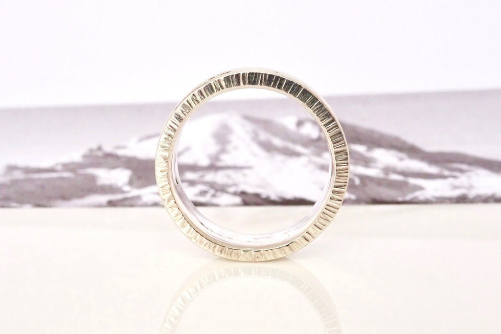 Each custom Summit Ring features Michelle Lenáe's signature texture edge.