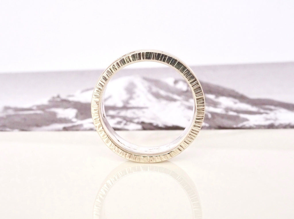 Each custom Summit Ring features Michelle Lenáe's signature texture edge.