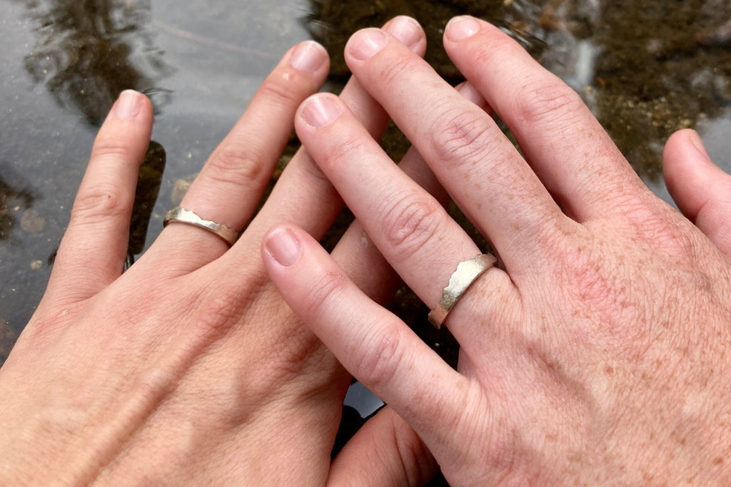 Recycled 14k White Gold Interlocking Mountain Range Rings featuring their favorite mountains.