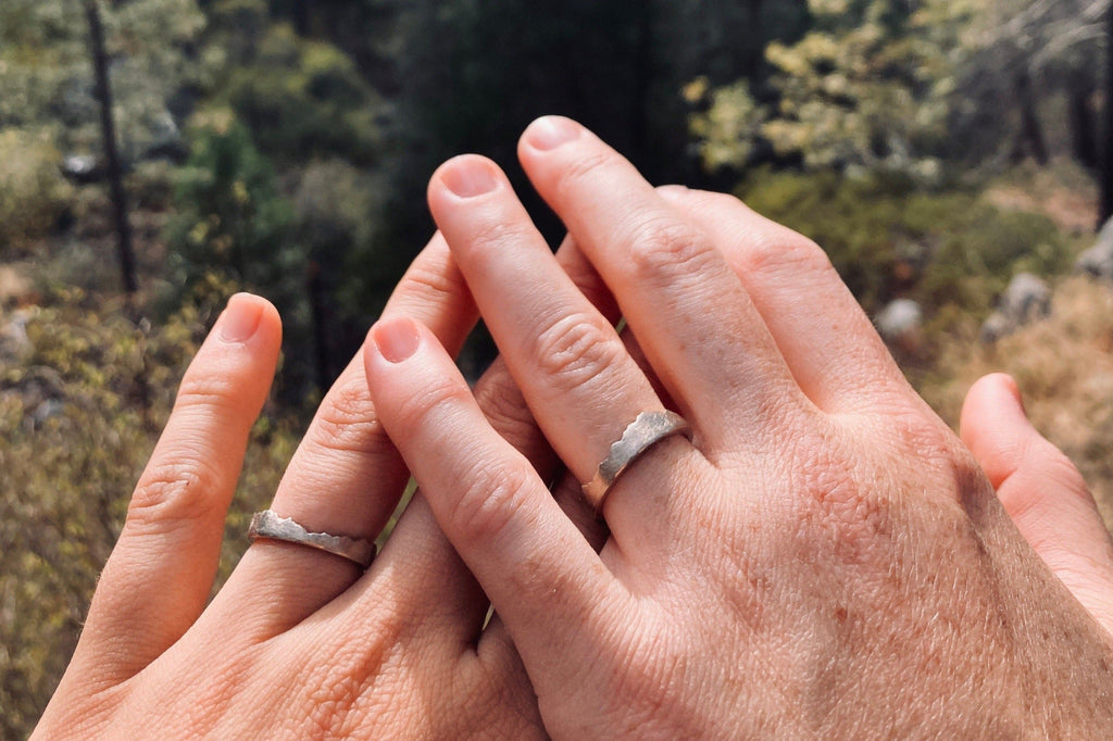 His & Hers Interlocking Split Puzzle Mountain Ring in recycled sterling silver. 
Handmade to order with their favorite mountain range.